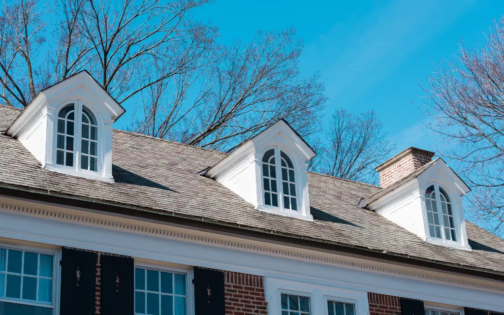 Row of custom arched dormer windows installed on a classic shingle roof in Toledo, Ohio.