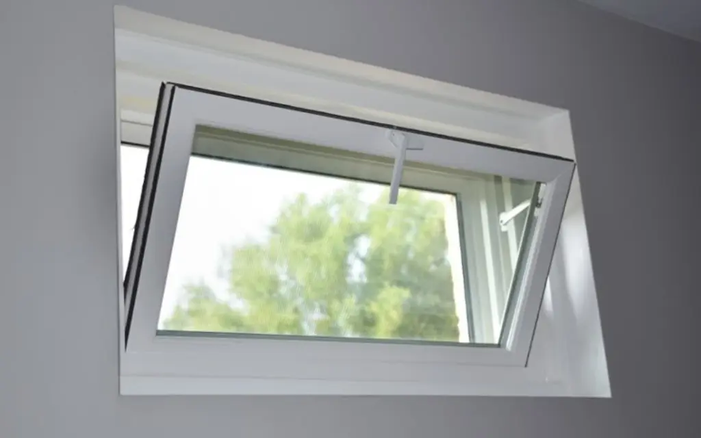 Interior view of a modern hopper window replacement installed in a home in Toledo, Ohio.